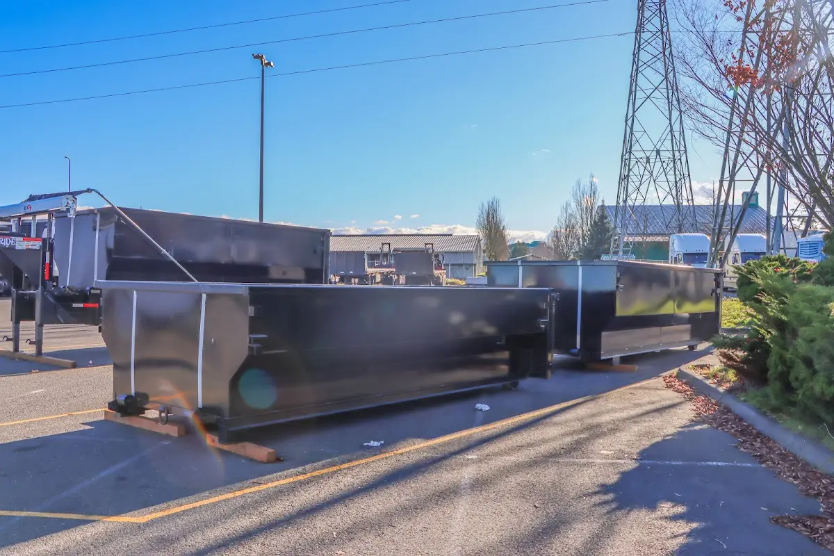 Roll-off dumpster ready for waste disposal at job site for Demolition Dumpster Rental in Walnut Ridge